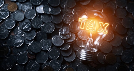 Tax word on light bulb money background Business and tax concepts. Tax payment 2022. New year 2022 tax concept.