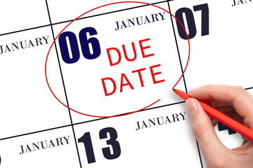Hand writing text DUE DATE on calendar date January 6 and circling it. Payment due date