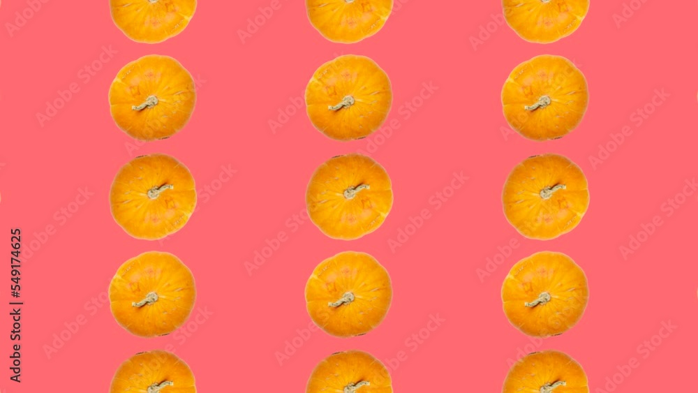 Poster orange pumpkins in grid in seamless loop pattern on a pink background. orange vegetables in seamless