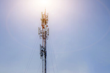 Telecommunication tower with sun background,cellular mobile pole communication technology.