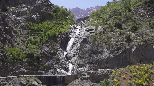 Landscape Waterfall with Toubkal view in Imlil, Morocco on a sunny day
