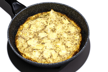 omelette in pan isolated on white background. Omelet with pepper and cheese