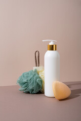 Body care concept white bottle soap and washcloth still life