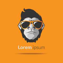 Logo head of a gorilla monkey in glasses on a bright orange background. Vector illustration