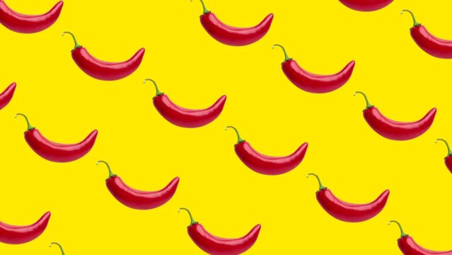 Seamless loop pattern with Chili peppers on a yellow background. Exotic fruits in seamless loop animation. Endless food motion graphic background