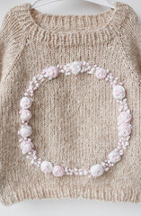 Baby knitted clothes. Handmade knitted clothes with embroidery.