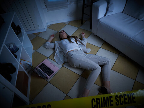 young woman lying dead on the floor after rape - crime scene