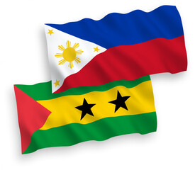 National vector fabric wave flags of Saint Thomas and Prince and Philippines isolated on white background. 1 to 2 proportion.