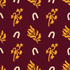 Obraz premium Bright brown and yellow vector seamless pattern with leaves. For prints, backgrounds, wrapping paper, textile, linen, wallpaper, etc.