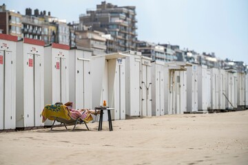 Vertical shot of a series of beach huts close to the North Sea in Belgium