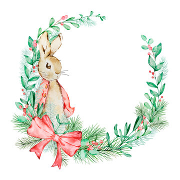 Watercolor Peter Rabbit with a wreath of winter greenery