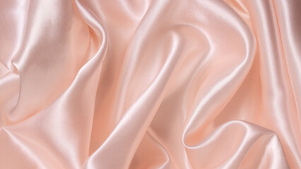 Beautiful smooth elegant wavy peach orange satin silk luxury cloth fabric texture, abstract background design. Copy space.
