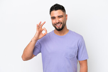 Fototapeta premium Young Arab handsome man isolated on white background showing ok sign with fingers