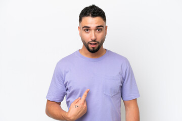 Young Arab handsome man isolated on white background pointing to oneself