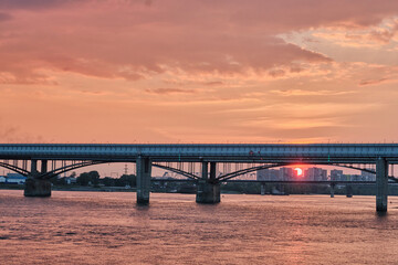 Fototapeta na wymiar Bridges over Ob river on sunset in Novosibirsk, Russia.