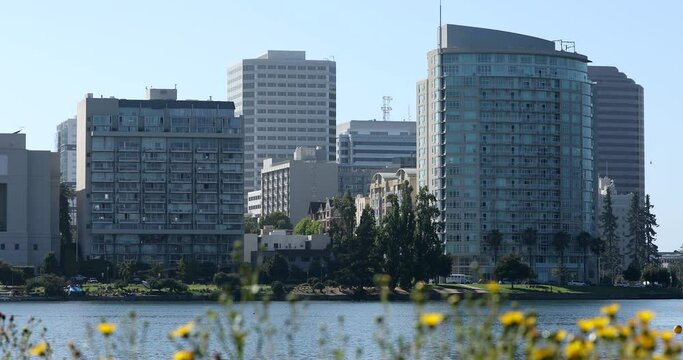 Afternoon view of the lake shore skyline of Lake Merritt in Oakland, California, USA.
