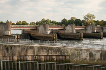 Dam (weir) of a hydro power plant along Weser river (Bremen). Water cascading down a barrage.  Weir called 