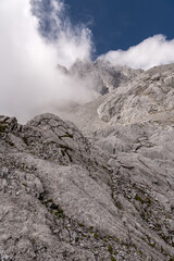 Epic vertical view of Jade Dragon Snow Mountain with a cloud and blue sky