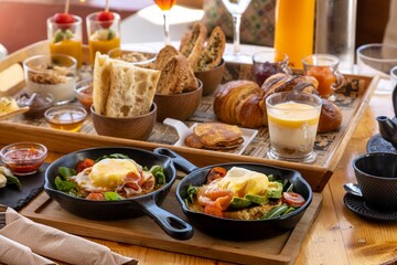 Closeup of a breakfast menu delicacies served on wooden boards