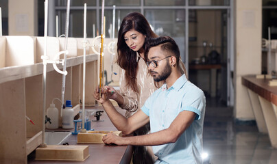 Indian students working or experimenting in science lab.