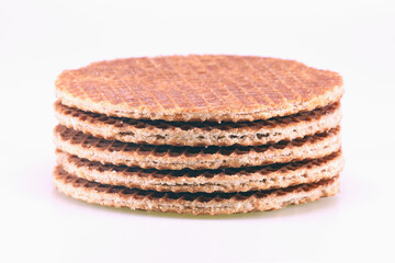 A close-up of stroopwafels, a typical Dutch delicacy, isolated on white
