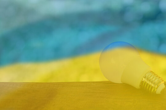 Energy problem concept Ukraine Flag. Increased energy consumption in Ukraine. Energy crisis in Ukraine. Destruction of the electrical network. No electricity.