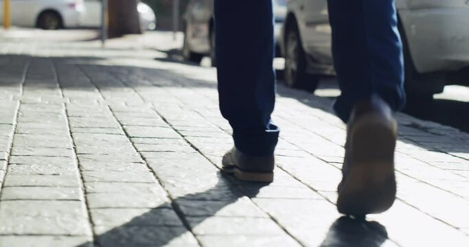 Businessman, travel and feet walking on city ground for work commute with leather formal shoes. Urban, corporate and professional executive person walk on pedestrian sidewalk back view.