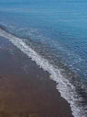 sandy beach and sea waves