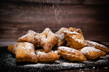 TRADITIONAL WONDERS OF SOUTH-WESTERN FRANCE, SPRINKLED WITH ICING SUGAR AND FLAVOURED WITH RUM AND ORANGE FLOWER WATER, High quality photo