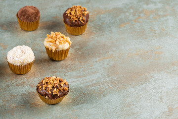 Brigadeiro is a common Brazilian dessert. Delicious chocolate candy Brigadeiro on a table