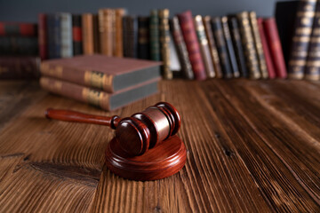 Law theme - judge office. Gavel and legal books on the judge desk. 