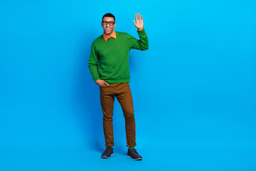 Naklejka premium Full length size photo of satisfied school teacher young guy wear stylish gentleman outfit shake palm hello everybody isolated on blue color background
