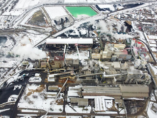Aerial drone view of industry complex. Factory chimneys. Industrial air pollution from smokestacks. 