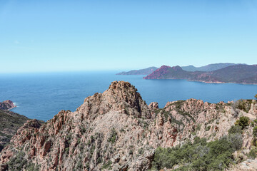 Fototapeta na wymiar Views in Corsica with mountain rocks and the sea. 