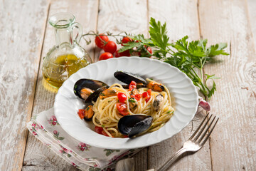 pasta with mussels fresh cherry tomatoes and parsley, traditional italian recipe