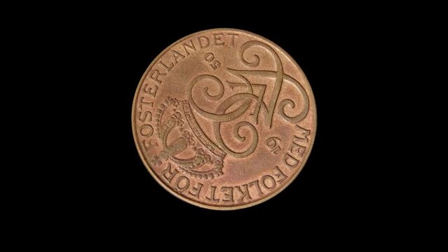 Rotating obverse of Sweden coin 5 ore 1950 isolated in black background. Close up view.