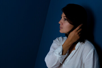 portrait of a young woman on a black background