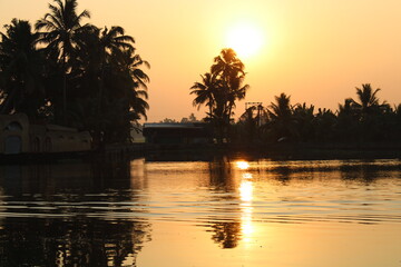 sun set sun rise boat ocean lake reflection