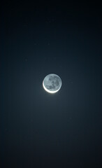bright crescent in the night sky with star