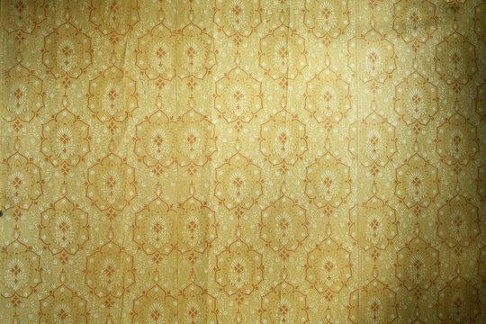 Fototapeta Old wallpaper on the wall. Old wallpaper for texture or background.