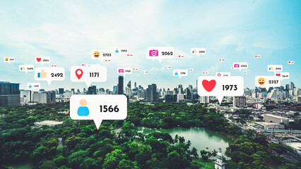 Social media icons fly over city downtown showing people reciprocity connection through social...