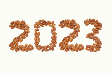 2023 Written with Almond Nut Isolated on White Background in Horizontal Orientation, Happy New Year...