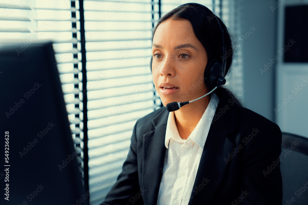 Aufkleber competent female operator working on computer and talking with clients. concept relevant to both cal