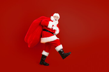 Full length body size profile side view of his he nice funny cheery amazed white-haired Santa...