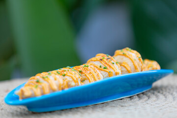 Sushi is a Japanese dish of prepared vinegared rice, usually with some sugar and salt, accompanied by a variety of ingredients.