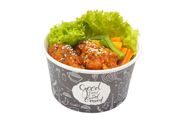 Fried chicken in spicy sauce sprinkled with sesame and vegetables isolated on white background. fast food concept