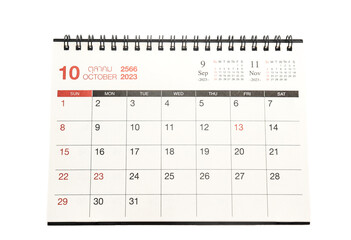 October 2023 desk calendar isolated on white background.