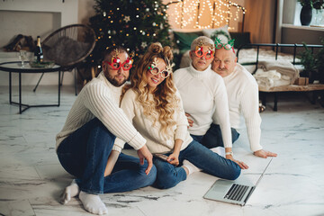 Happy four people celebrating the New Year together