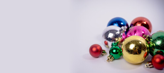 Christmas background with decorations. Gifts in craft paper, pine cones, red hearts and confetti.