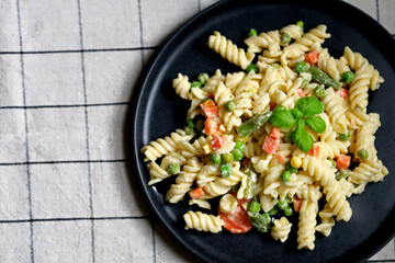 Pasta Salad with vegetables with sauce and spices.